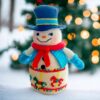 crochet snowman with embroidered carousel horses