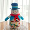 crochet snowman with embroidered carousel horses