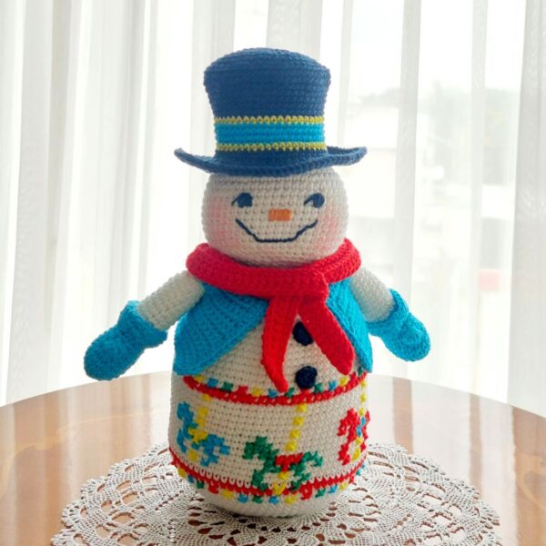 crochet snowman with embroidered carousel horses