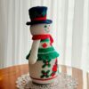 crochet pattern: snowman with embroidered cardinal bird