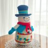 crochet snowman with embroidered carousel horses