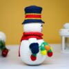 crochet snowman with festive christmas light bulbs