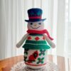 crochet pattern: snowman with embroidered cardinal bird