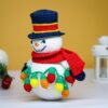 crochet snowman with festive christmas light bulbs
