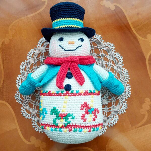 crochet snowman with embroidered carousel horses